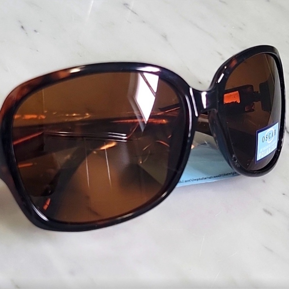 Oscar by Oscar de la Renta women's fashion sunglasses featuring a tortoiseshell